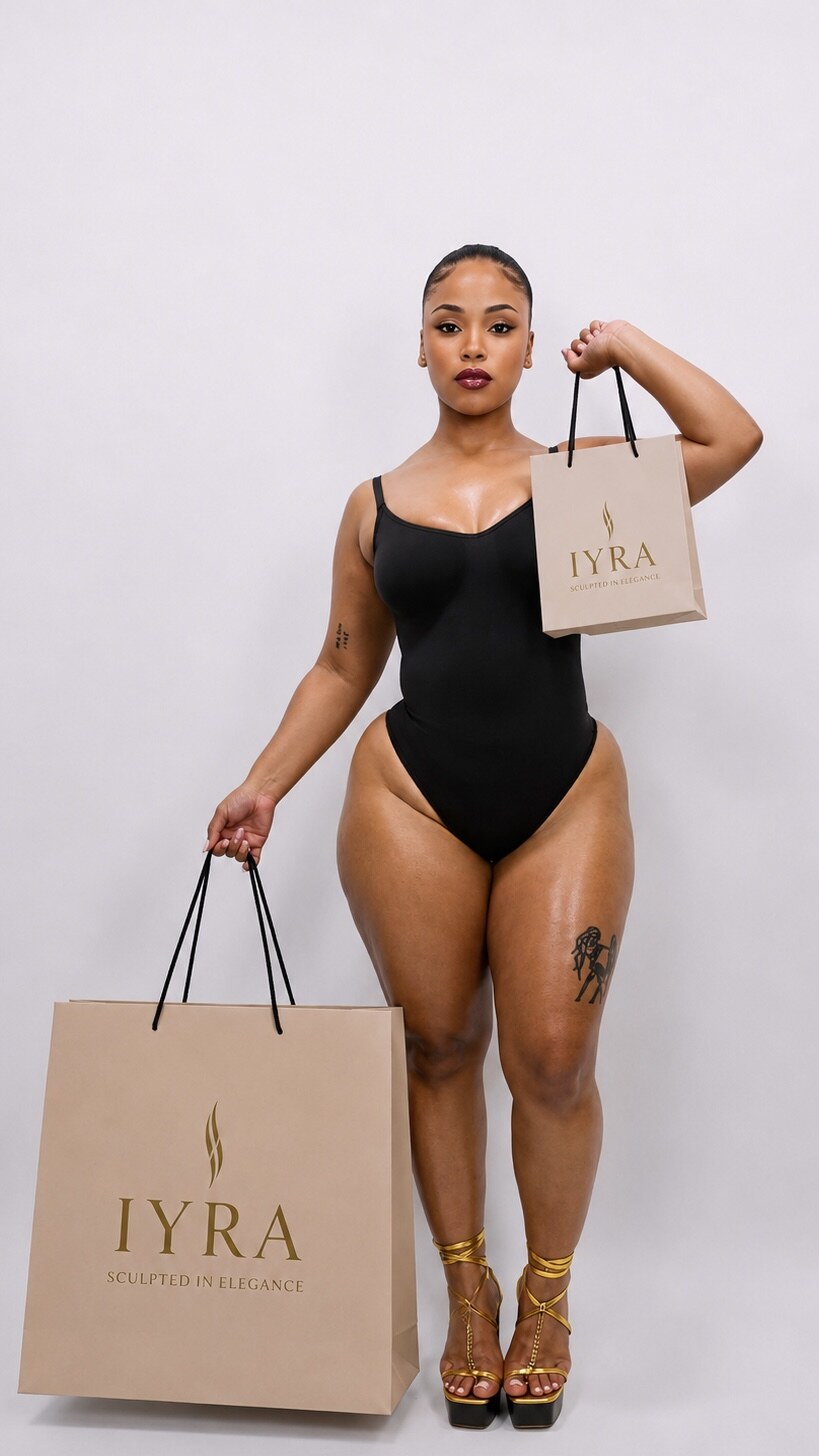 IYRA Shape campaign model wearing a black tank bodysuit while holding IYRA shopping bags.